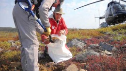 Helicopter pilot Tim Franke (standing) and geologist Bruce Kienlen sample till at Canterra Minerals' diamond project in the Southern Slave region of the Northwest Territories.  Credit: Canterra Minerals
