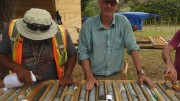 Precipitate Gold vice-president of exploration Michael Moore (facing camera) analyzes core from discovery hole 5 at the Ginger Ridge zone, part of the Juan de Herrera gold project in the Dominican Republic. Credit: Precipitate Gold