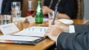 Taking notes during the PwC-TNM "Strategies for Cash Deployment" roundtable in Toronto in April 2017: Stephen Mullowney, partner in the corporate finance practice, focusing on mining, at accounting and management consulting firm PwC Canada. Credit: Erik Rotter for George Matthew Photography.