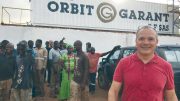 Sylvain Drolet (far right), director general of Orbit Garant Burkina Faso, at the company’s office in Burkina Faso. Credit: Orbit Garant.